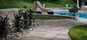 pool-slide-pavers-decorative-rock-jmt-landscapes-patio-paver-landscapers-builder-contractor-unilock-belgard-techo-bloc-natural-stone